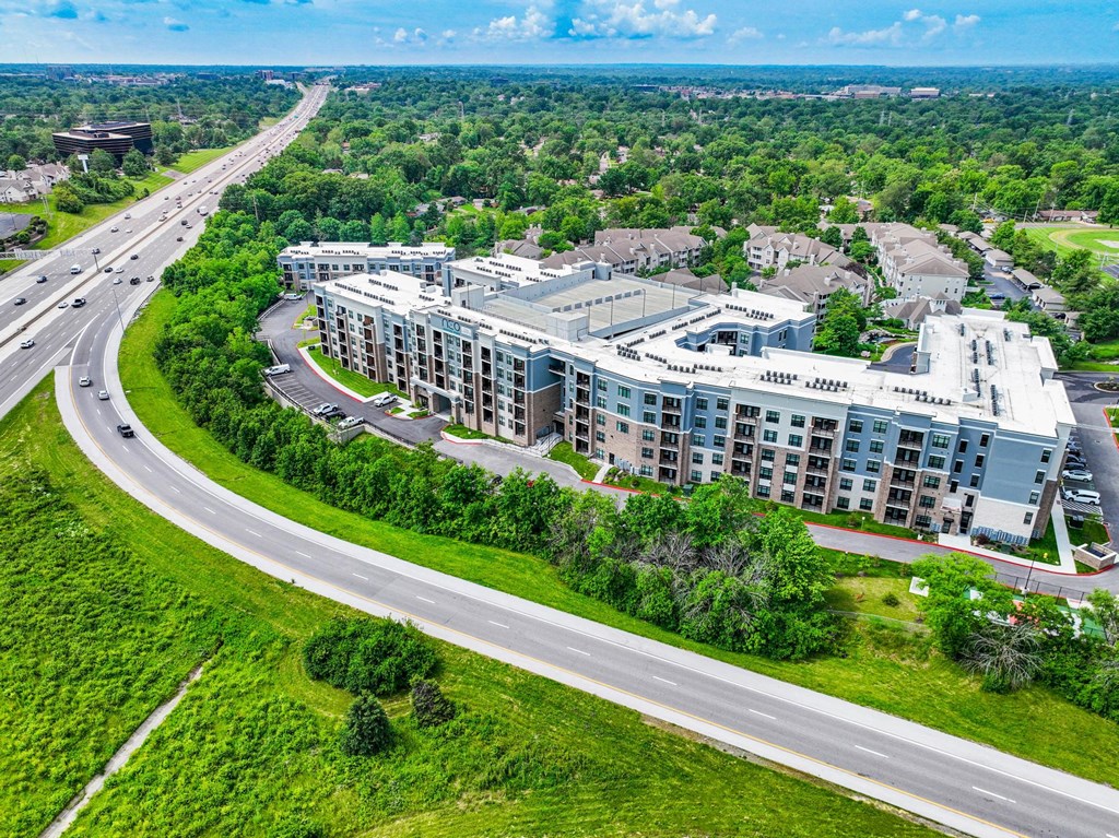 A large building with a parking lot in front of it.