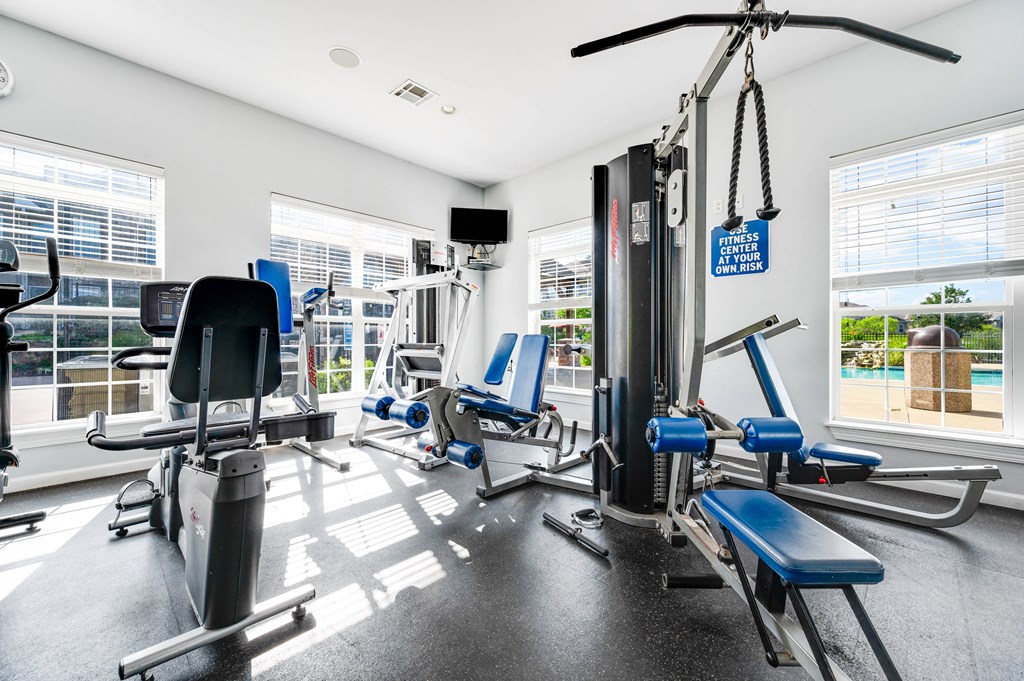 the gym at the enclave at woodbridge apartments in sugar land, tx