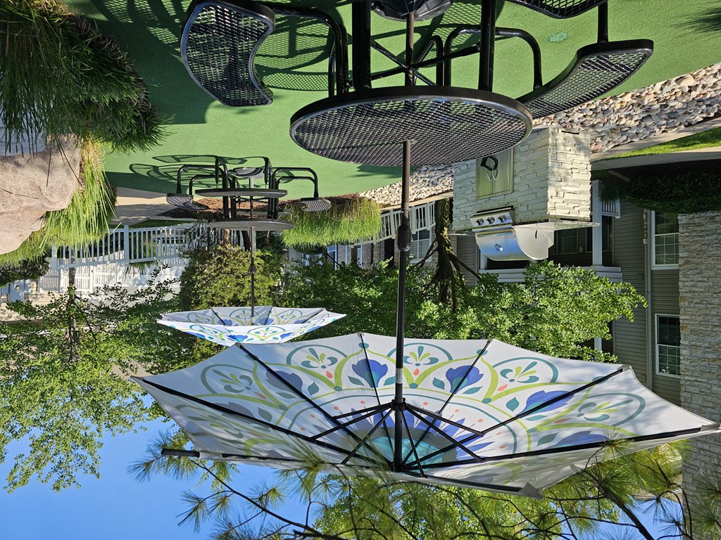 three umbrellas hanging in front of a building