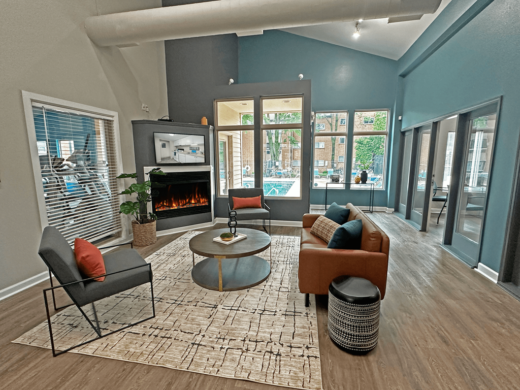 a living room with blue walls and a fireplace
