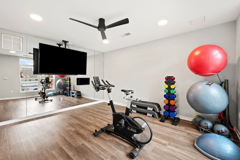 the preserve at ballantyne commons fitness room with exercise equipment and a tv
