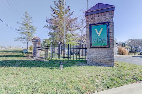 the gate at the entrance to vida residences sign