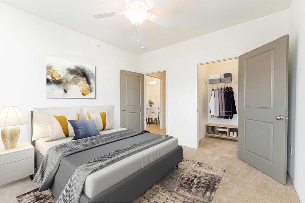 a bedroom with a large bed and a closet