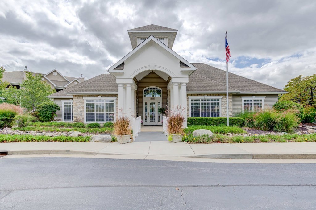a house with a flag on a pole in front of it
