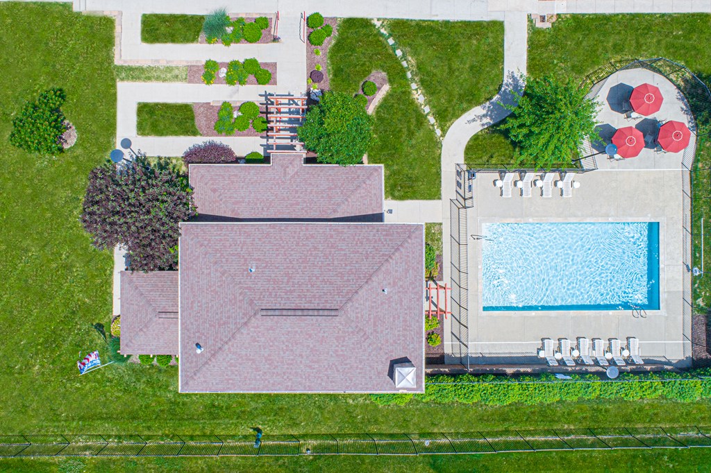 a birds eye view of a house with a swimming pool