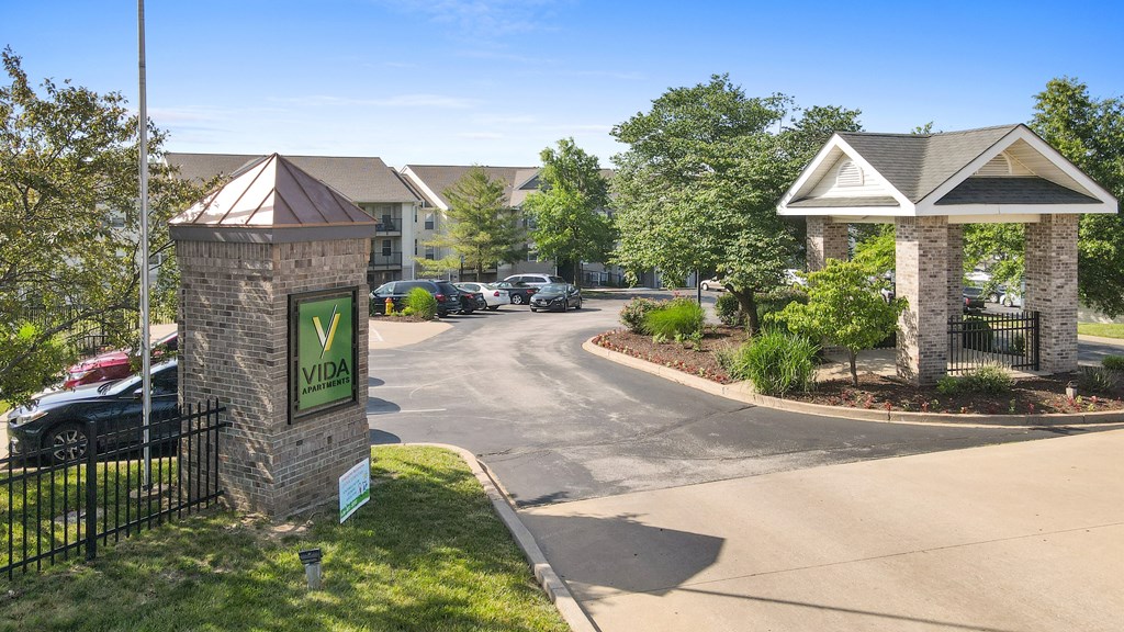 a building with a sign on the side of a road