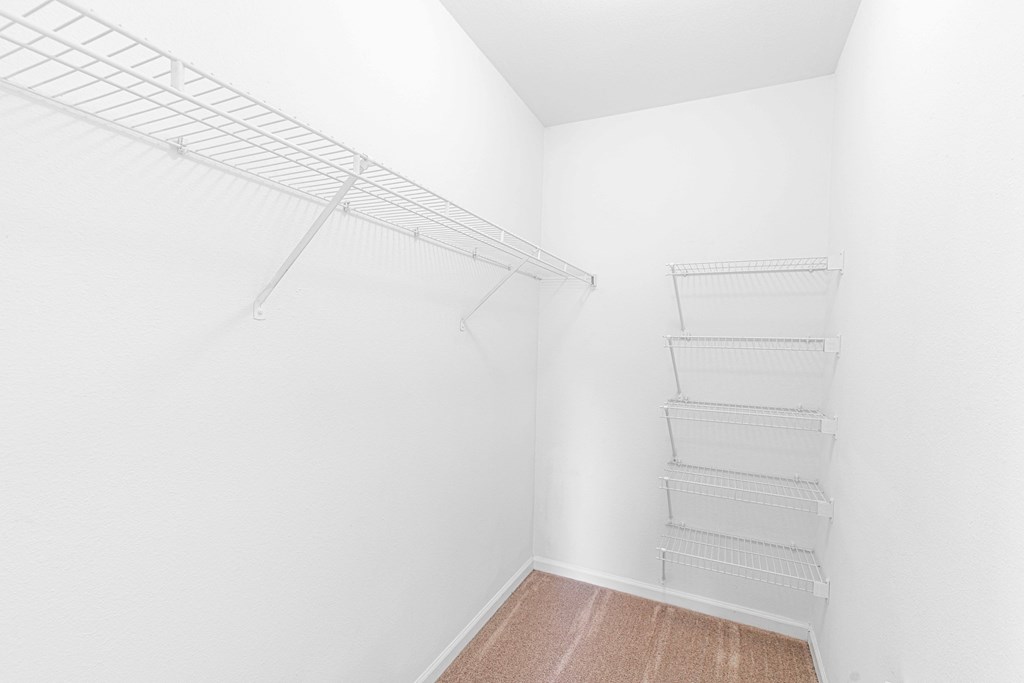a walk in closet in a 555 waverly unit