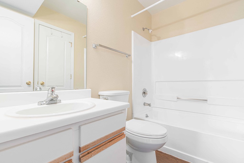 a bathroom with a sink toilet and bathtub