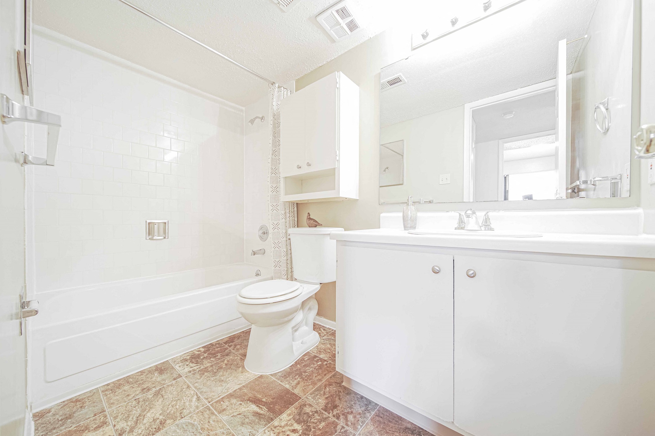 a bathroom with a sink toilet and a bath tub