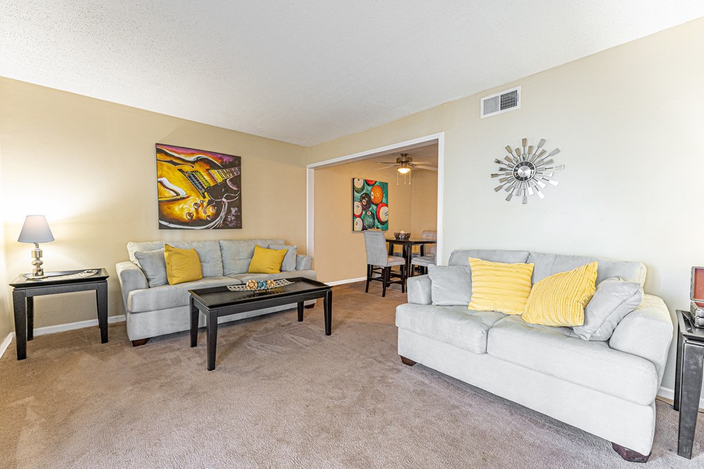a living room with two couches and a coffee table