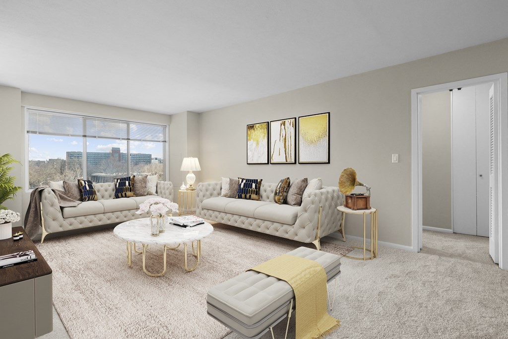 an apartment living room with couches and a table