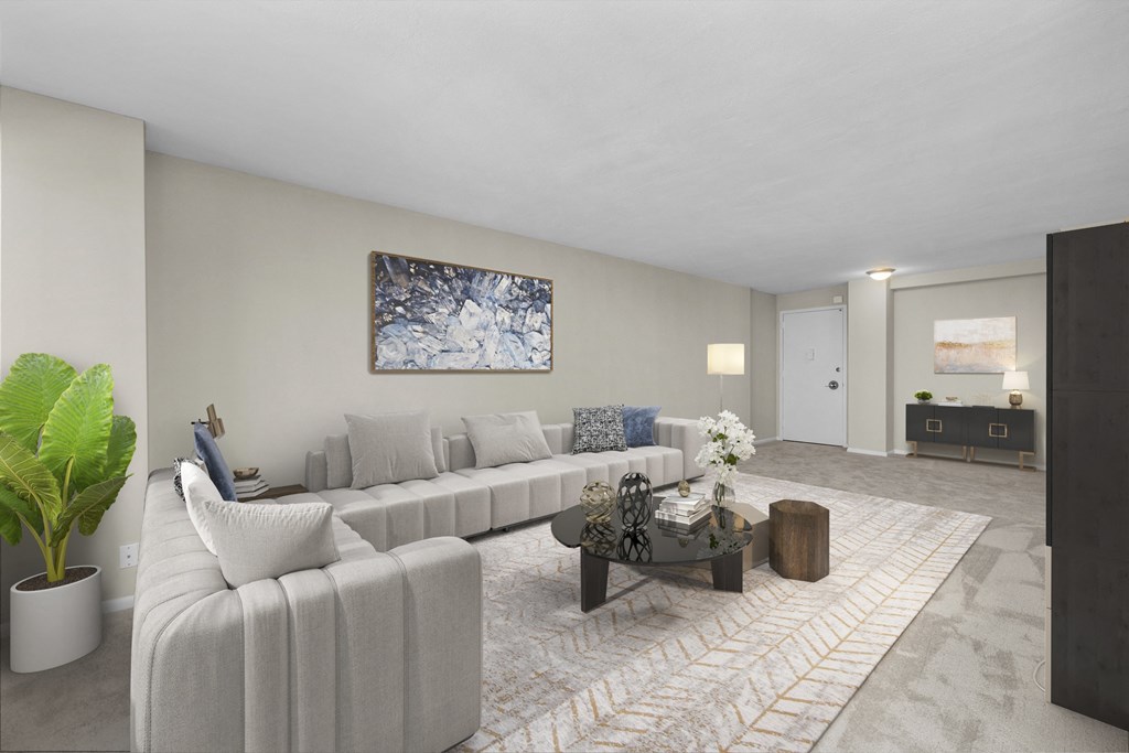 a living room with white couches and a coffee table