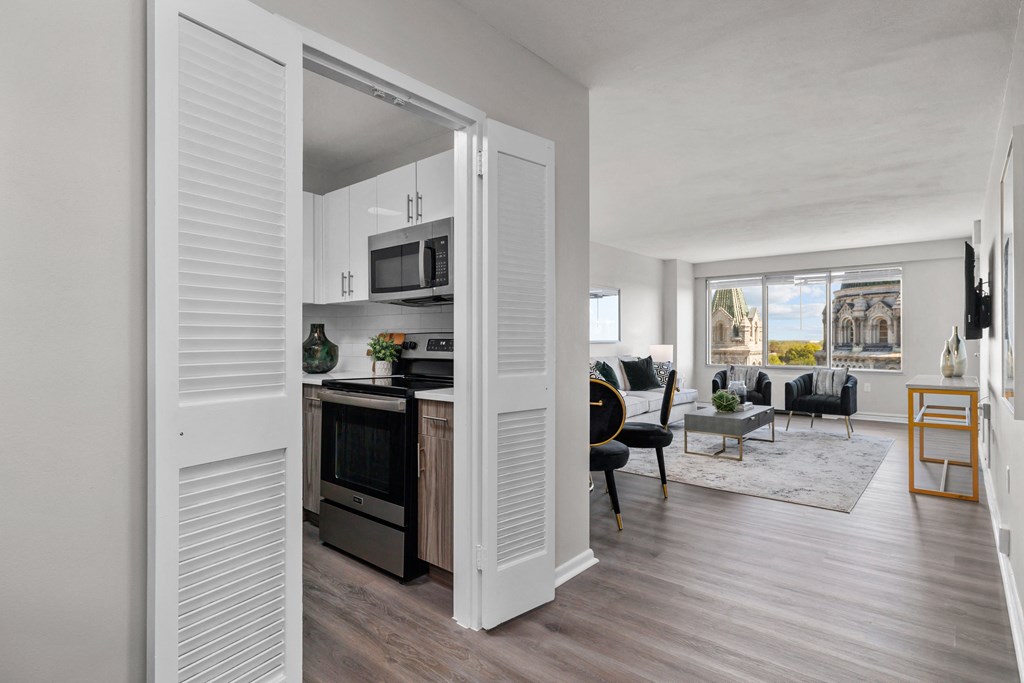 a kitchen and living room in a 555 waverly unit