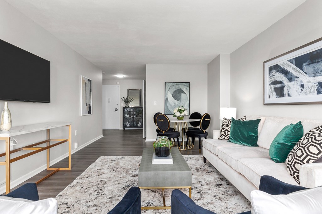 a living room with grey walls and a white couch