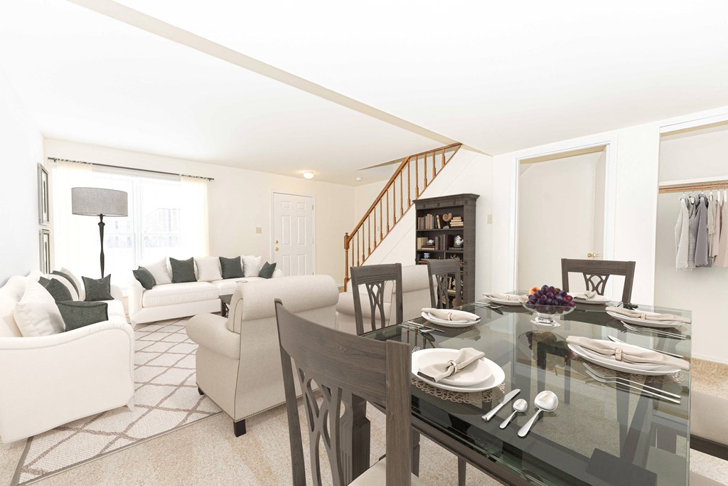 a living room and dining room with a glass table
