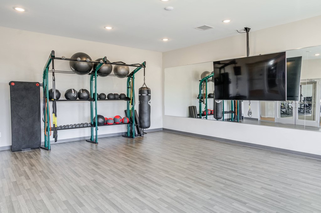 Citrine on-demand fitness center with virtual classes, stationary bikes and open area
