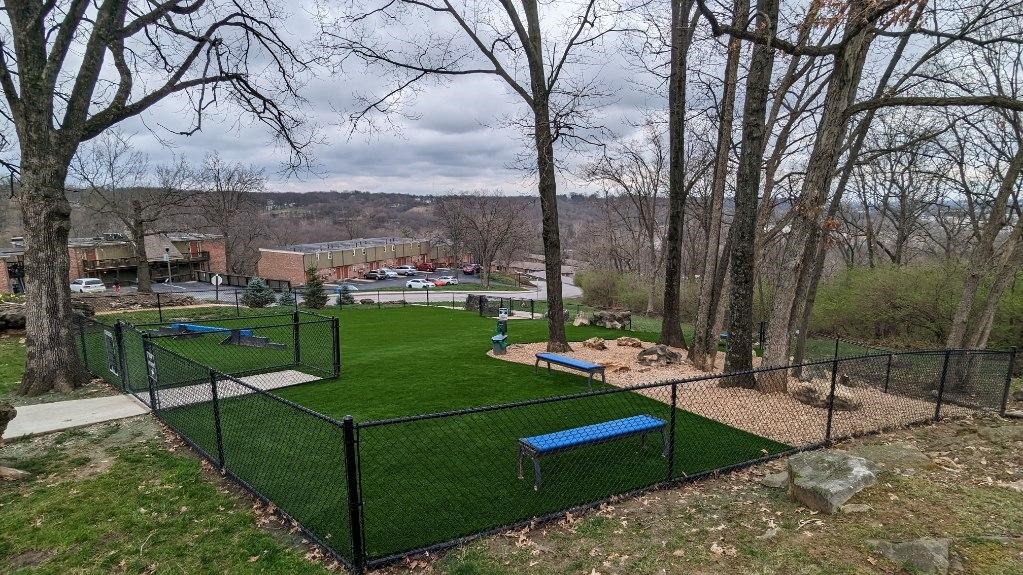 a park with a tennis court and benches