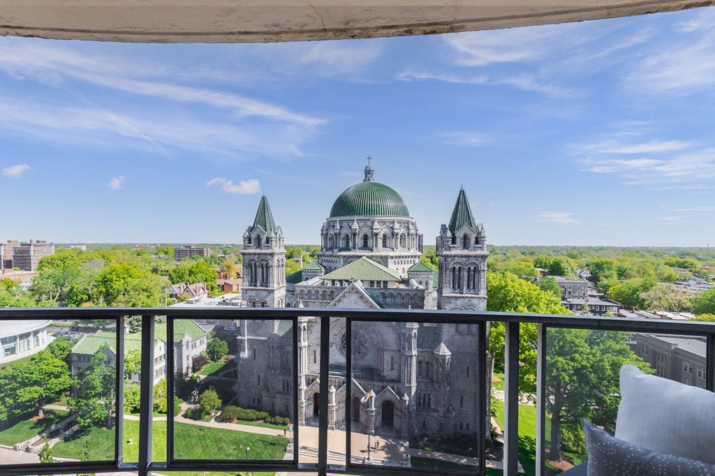 a balcony with a view of a large building