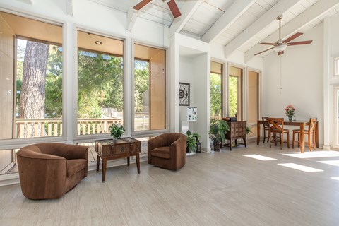 A living room with a brown chair and a brown table.