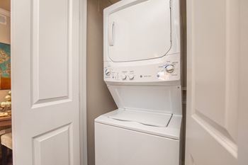 A white dishwasher is installed in a kitchen.