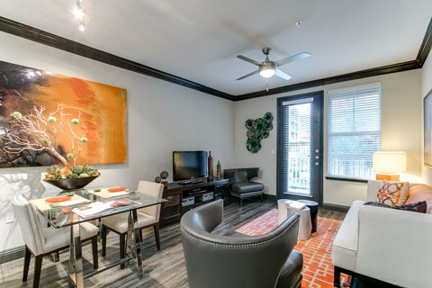 a living room and dining room with a couch and a table