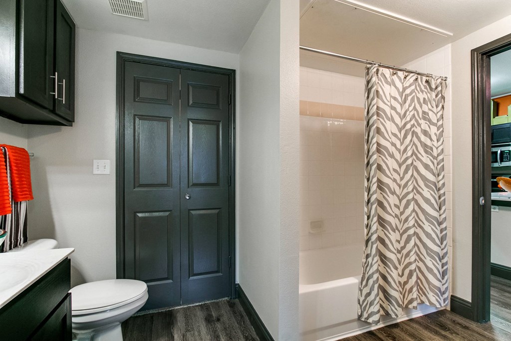 the residence on lamar apartment bathroom with shower and toilet