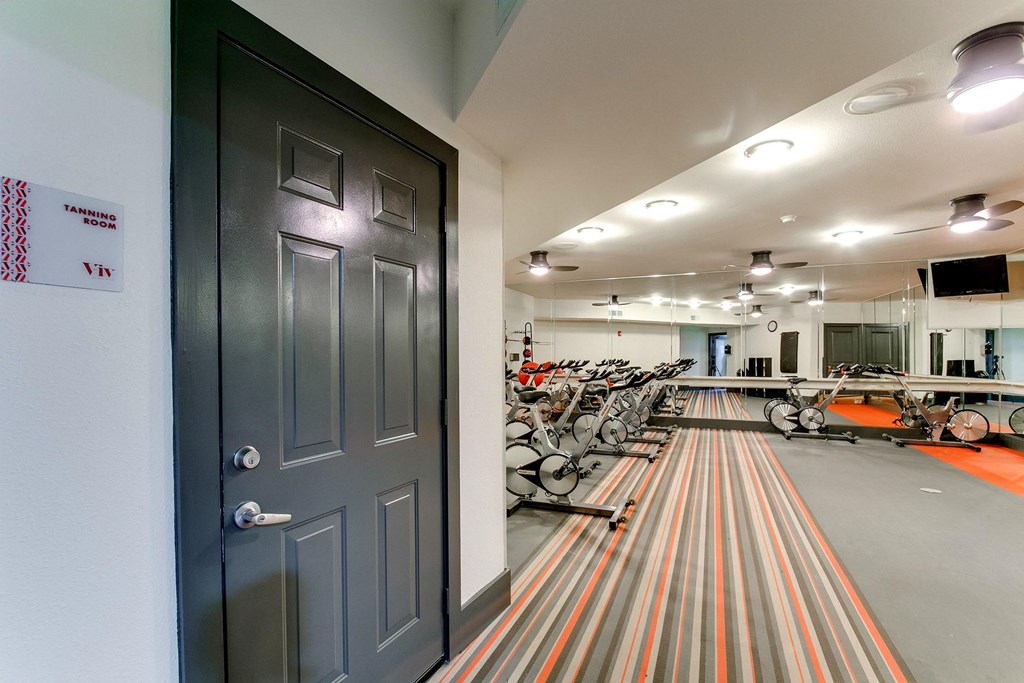 the gym at the district flats apartments in lenexa