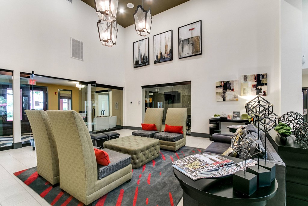 a lobby with couches and chairs and a table