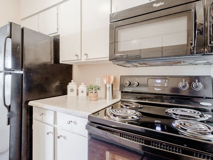 a kitchen with a stove and a microwave