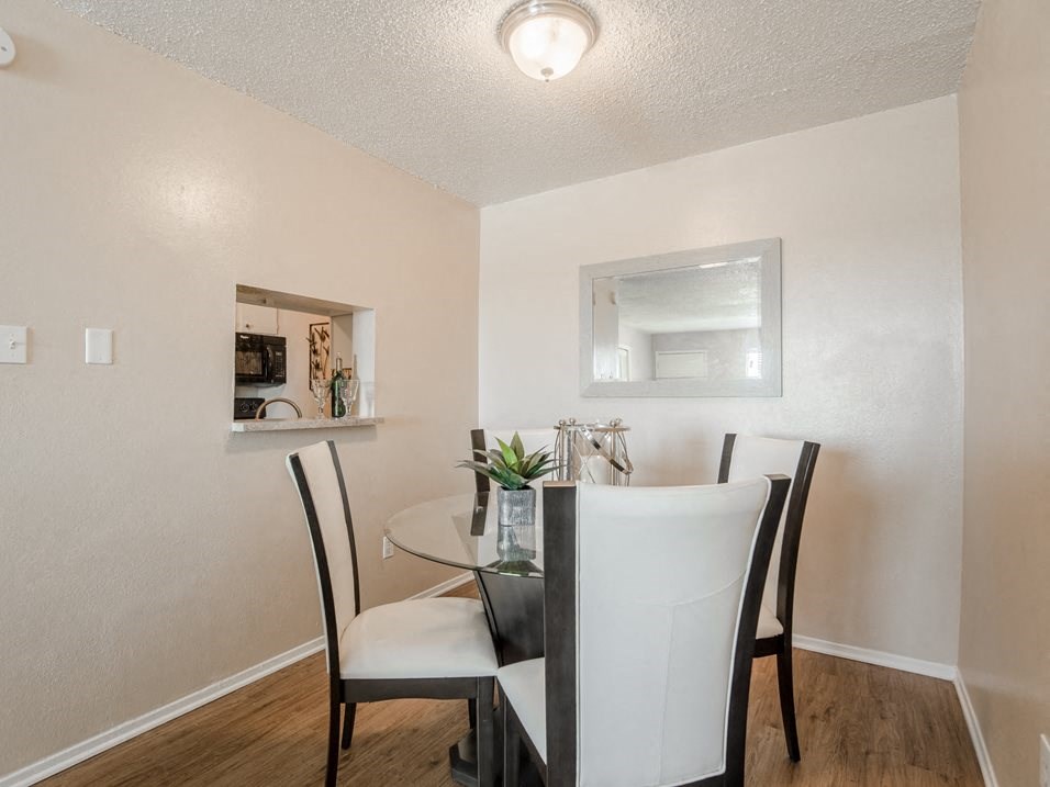 a dining room with a table and chairs