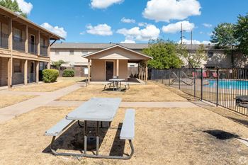 our apartments have a picnic table and a pool in our yard