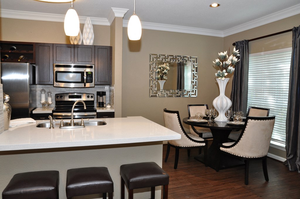 interior view of dining room table and bar area in kitchen