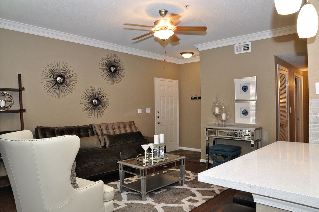 Interior room with white chair and brown couch
