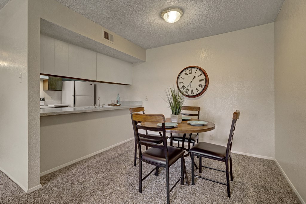 our apartments have a dining room and kitchen with a large clock