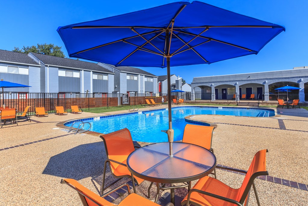 our apartments have a pool and table with umbrellas
