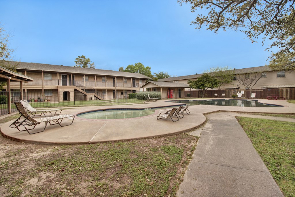 our apartments have a swimming pool and a courtyard with lounge chairs