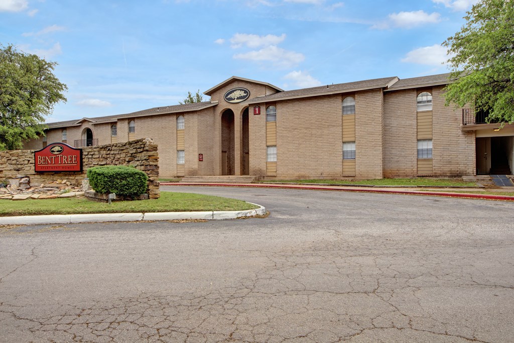 a brick building with a clock on the front of it