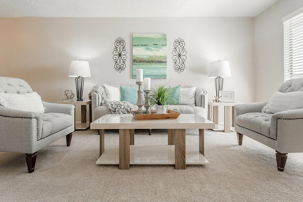 a living room with two couches and a table