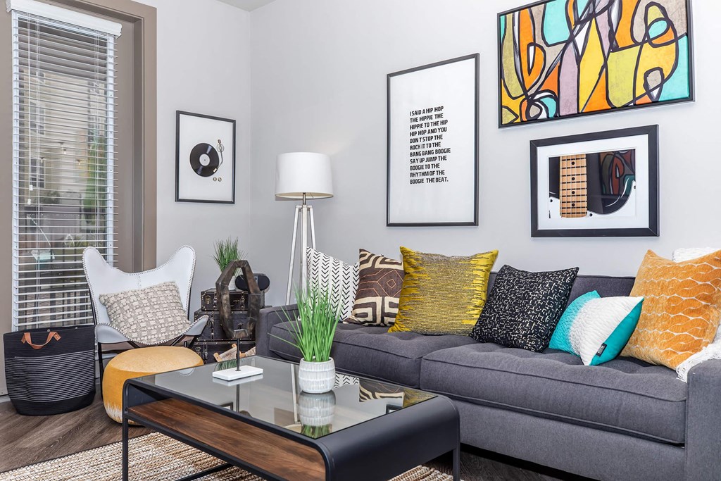 a living room with a gray couch and a coffee table