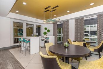 a dining room with a table and chairs