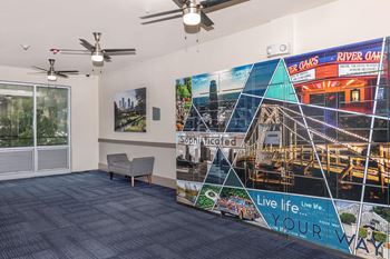 a lobby with a large mural on the wall