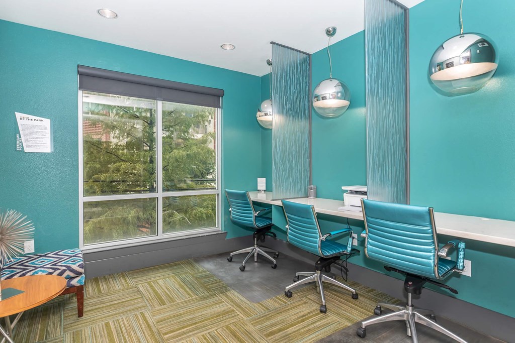 a conference room with chairs and a table and a window