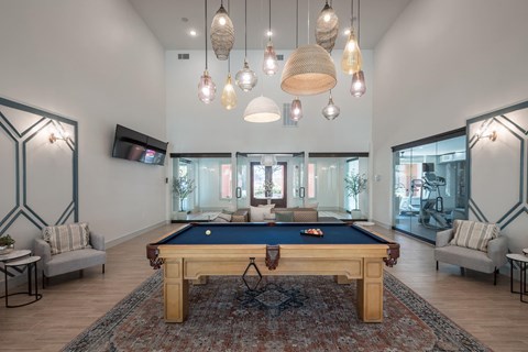 a pool table in the middle of a living room