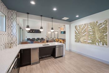 an open kitchen and living room with a counter top