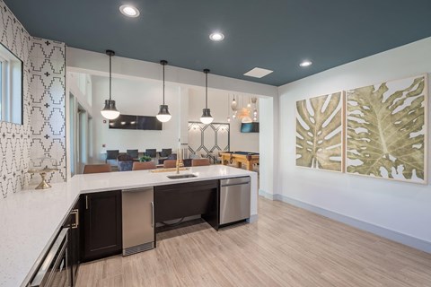 an open kitchen and living room with a counter top