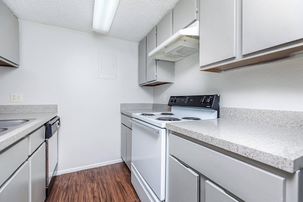 a kitchen with white appliances and white cabinets