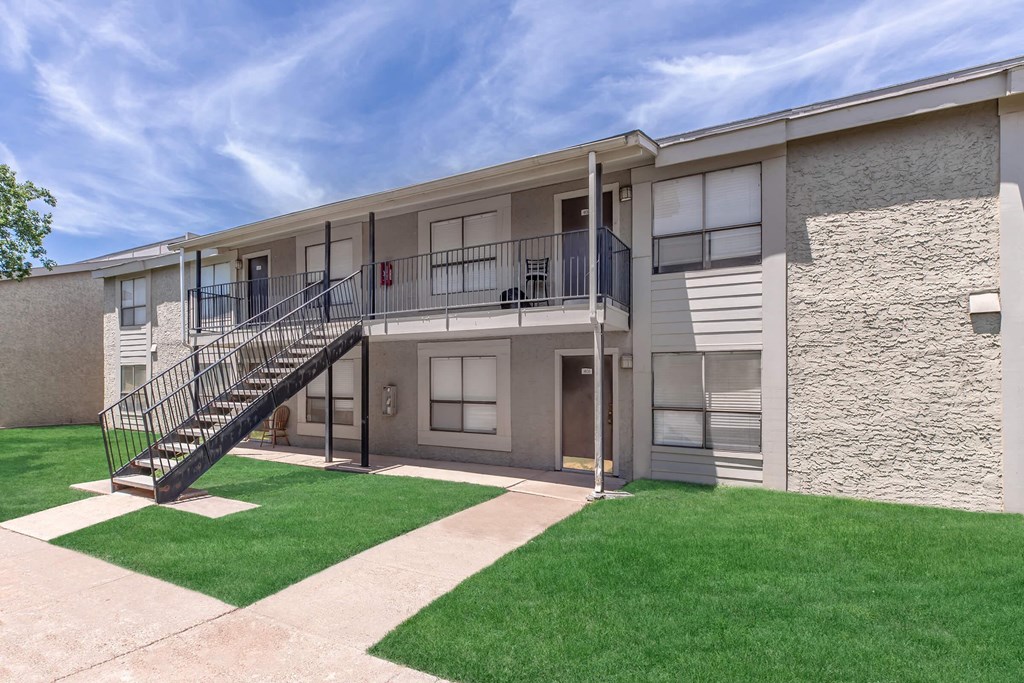 A building with a staircase and a balcony.