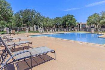 our apartments have a large pool and lounge chairs