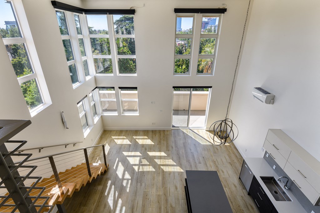 a view of a living room from the second floor of a loft