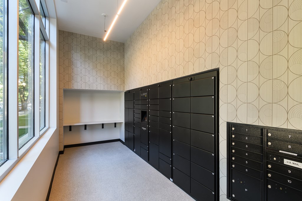 a large room with a row of lockers and a window